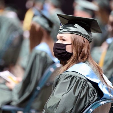 female graduate with mask